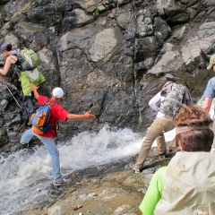 Crossing a stream on the way to Batad